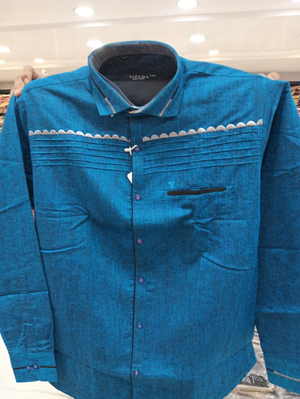 Blue shirt with white accent